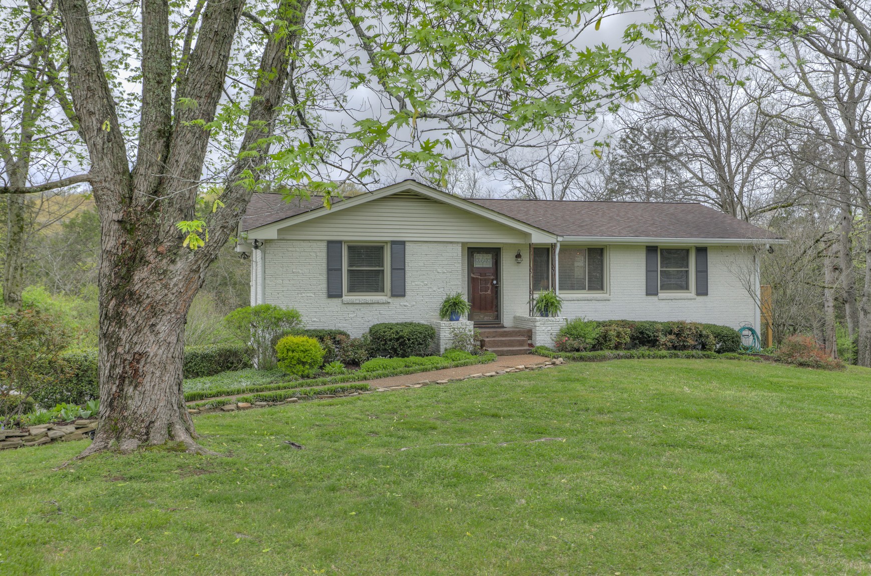 a front view of a house with a yard