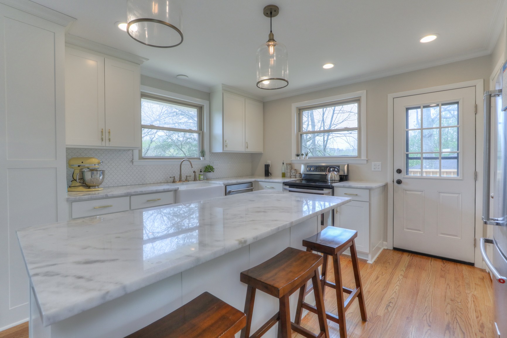 1217 Davidson Road Nashville, TN 37205 - Photo 12 of 43 a kitchen with granite countertop white cabinets a sink a stove and a window