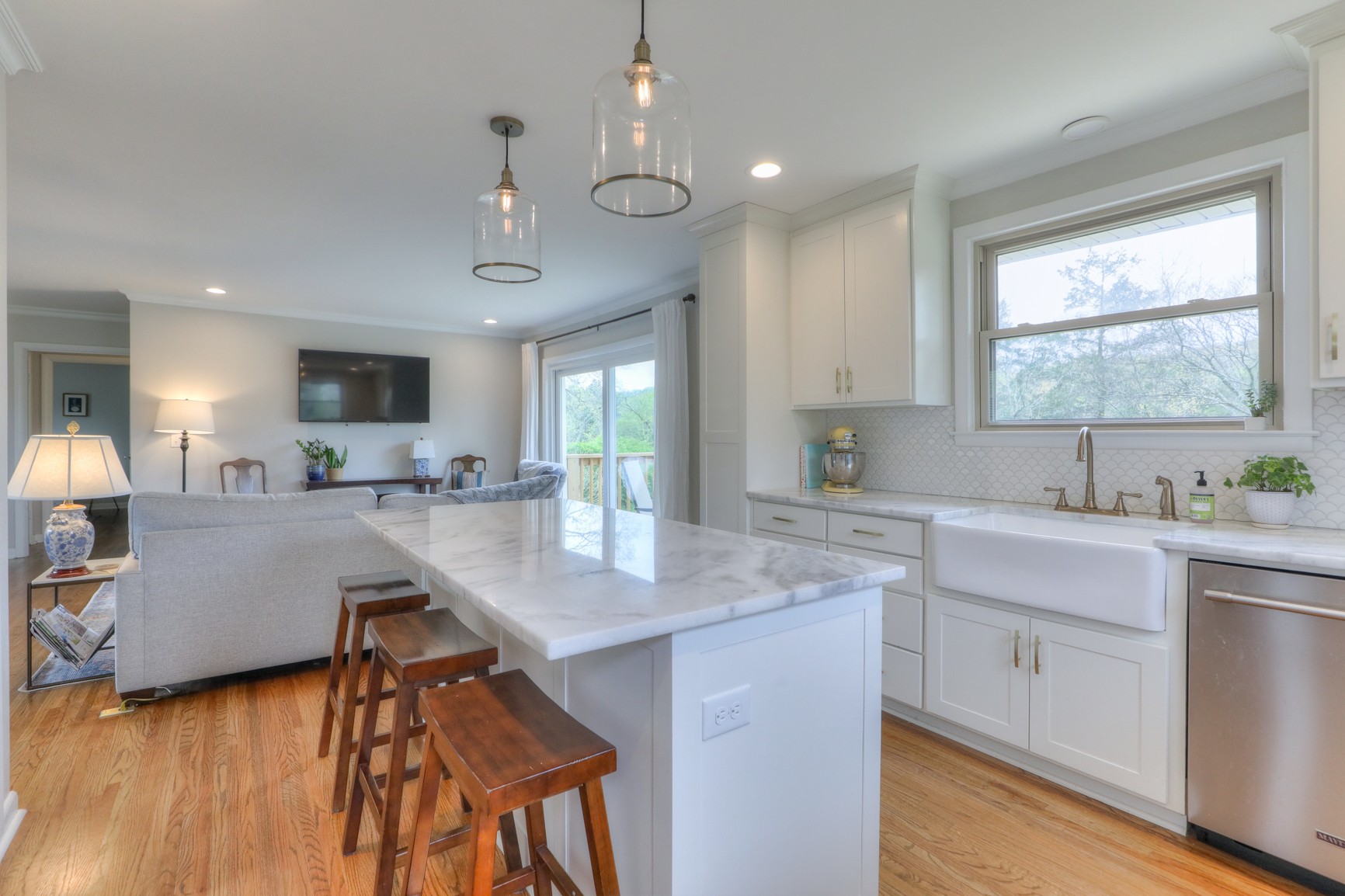 1217 Davidson Road Nashville, TN 37205 - Photo 13 of 43 a view of kitchen island a sink wooden floor and living room view
