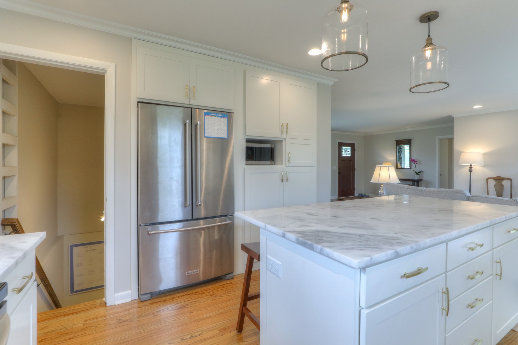 1217 Davidson Road Nashville, TN 37205 - Photo 16 of 43 a view of kitchen island a sink wooden floor and a refrigerator