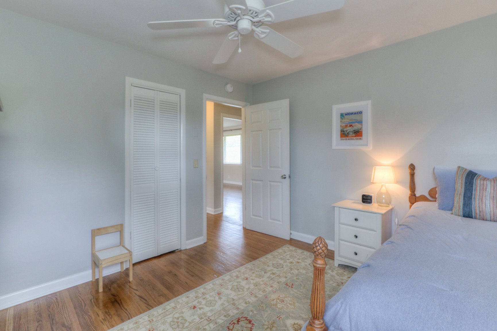 1217 Davidson Road Nashville, TN 37205 - Photo 19 of 43 a spacious bedroom with a bed and a chandelier