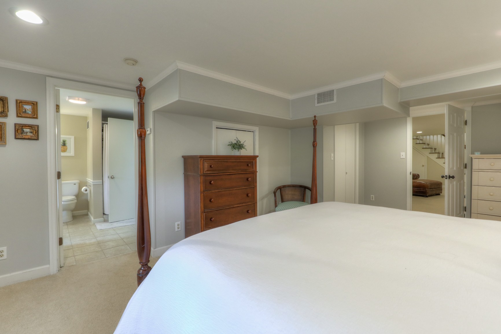 1217 Davidson Road Nashville, TN 37205 - Photo 29 of 43 a bedroom with a large bed and a chandelier