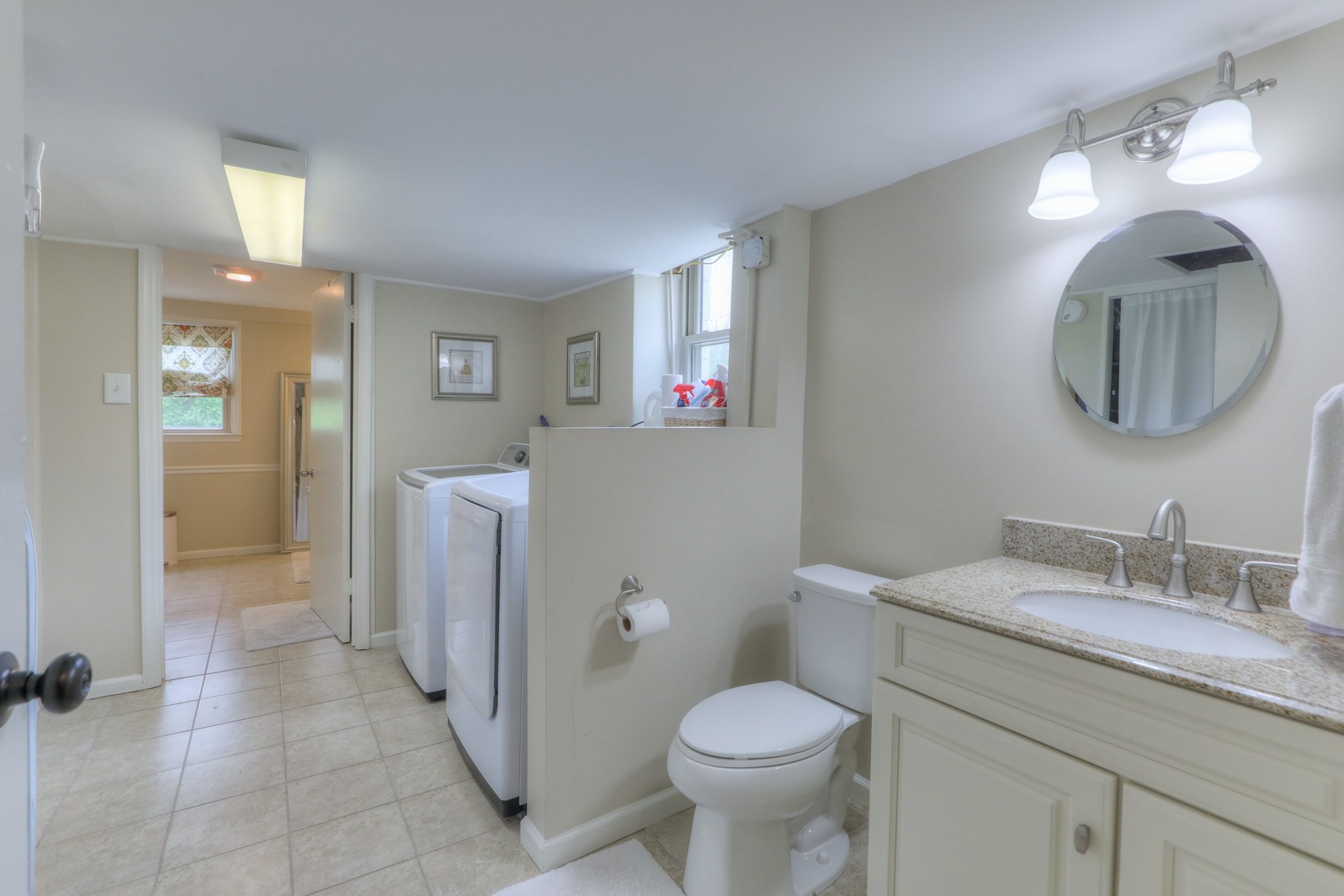1217 Davidson Road Nashville, TN 37205 - Photo 33 of 43 a bathroom with a toilet a sink and mirror
