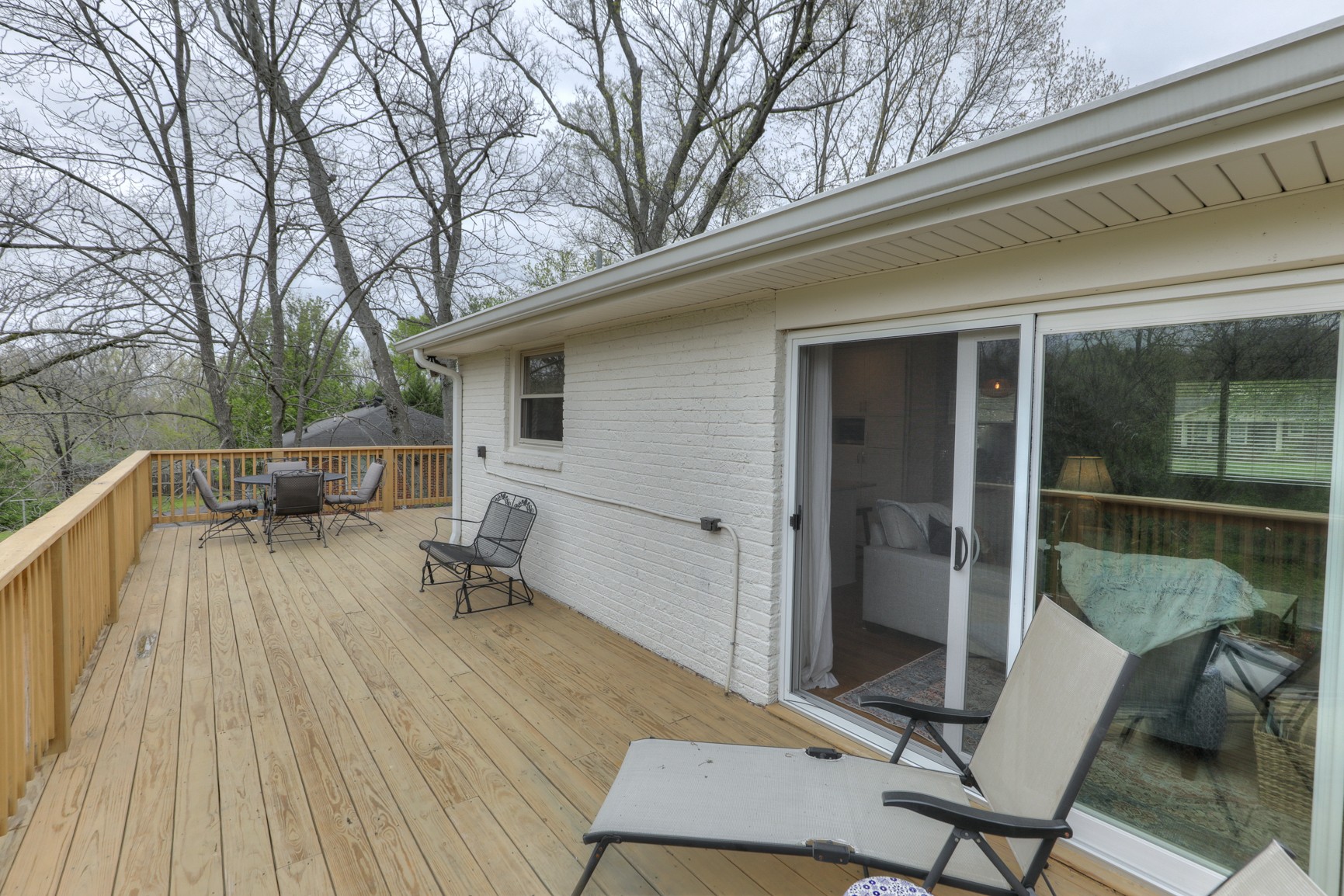 1217 Davidson Road Nashville, TN 37205 - Photo 34 of 43 a roof deck with table and chairs and wooden floor