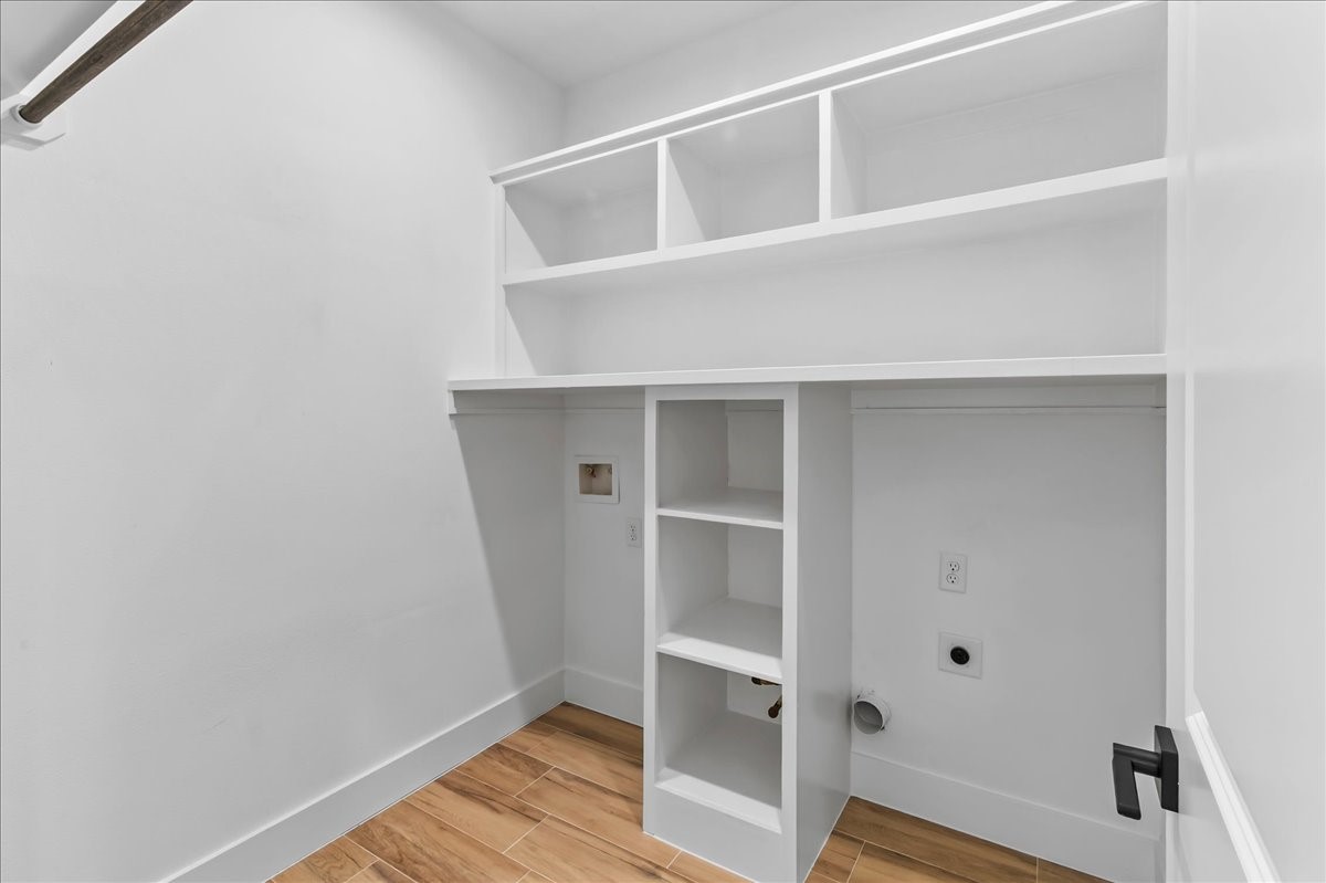 8323 Observatory Street, Unit A/B Houston, TX 77088 - Photo 31 of 38 Convenient laundry room featuring both electrical and gas connections for added flexibility and functionality. Design may vary. Pictures are from a previous build.
