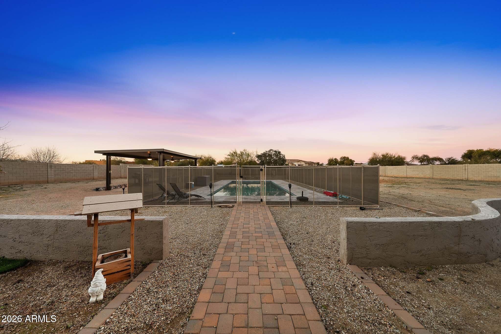 23024 West Sierra Ridge Way Wittmann, AZ 85361 - Photo 74 of 99 a view of a terrace with sitting area