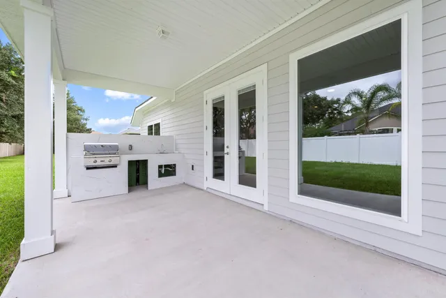 a view of a patio with a backyard