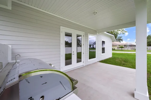 a view of yard with swimming pool and green space