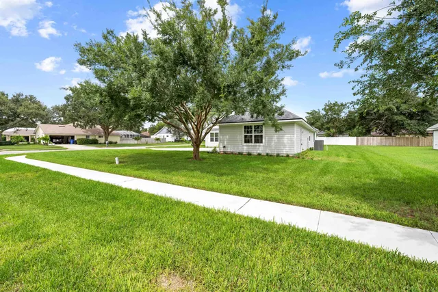 a view of a house with a big yard