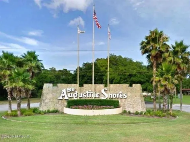 a view of a lake with a yard