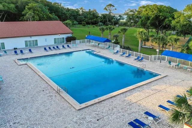 a view of a park with iron fence