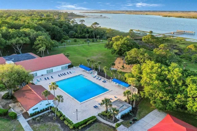 a view of a park with large trees
