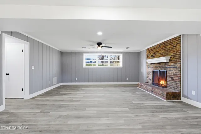 a bathroom with a granite countertop sink a toilet and a mirror