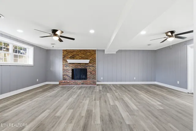 an aerial view of a house with a lake view