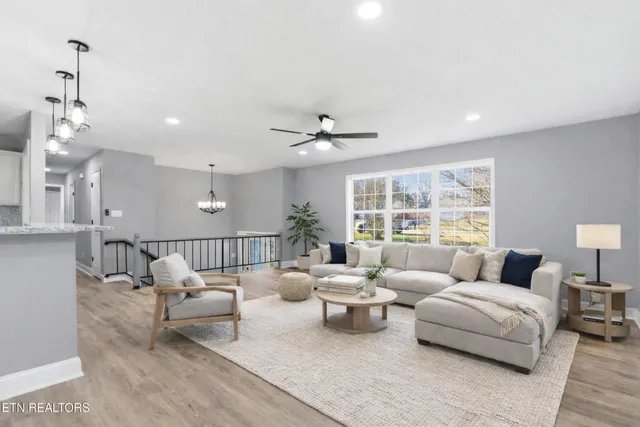 a kitchen with a sink cabinets and wooden floor