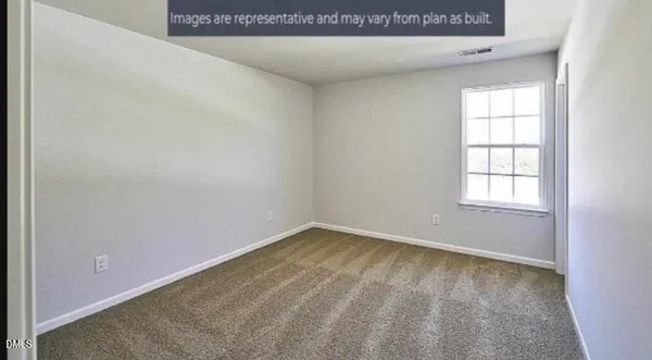a bathroom with a sink a toilet and shower curtain