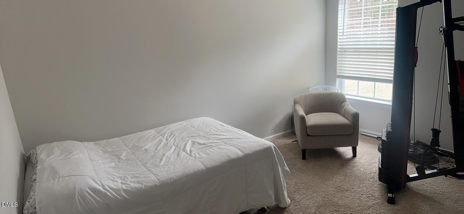 7643 Jordan Road Rocky Mount, NC 27803 - Photo 9 of 23 a bedroom with a bed and a window