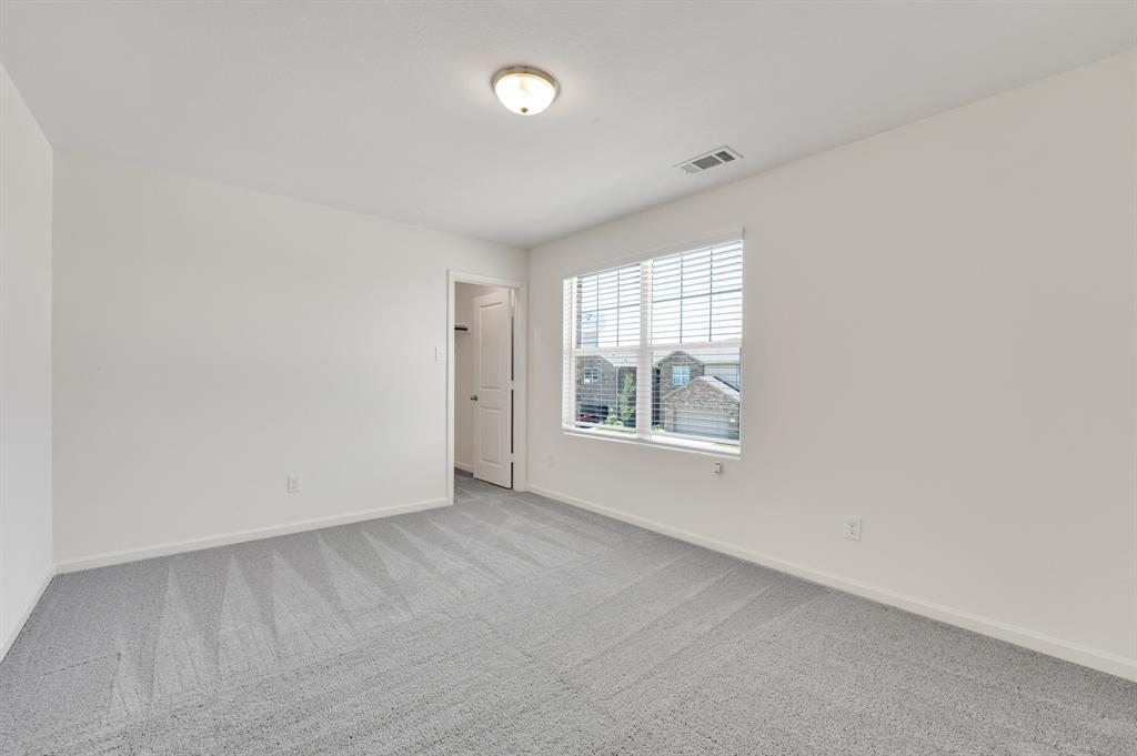1707 Washington Street Princeton, TX 75407 - Photo 15 of 21 an empty room with windows