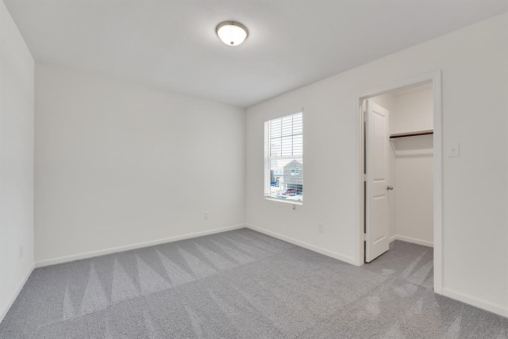 1707 Washington Street Princeton, TX 75407 - Photo 17 of 21 an empty room with windows
