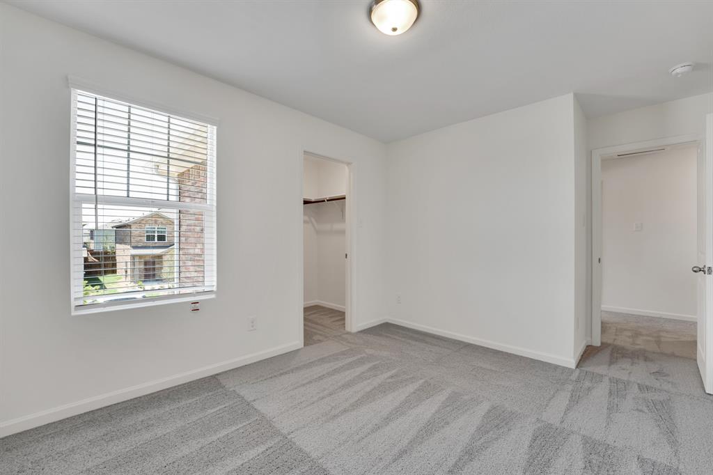 1707 Washington Street Princeton, TX 75407 - Photo 18 of 21 an empty room with a window
