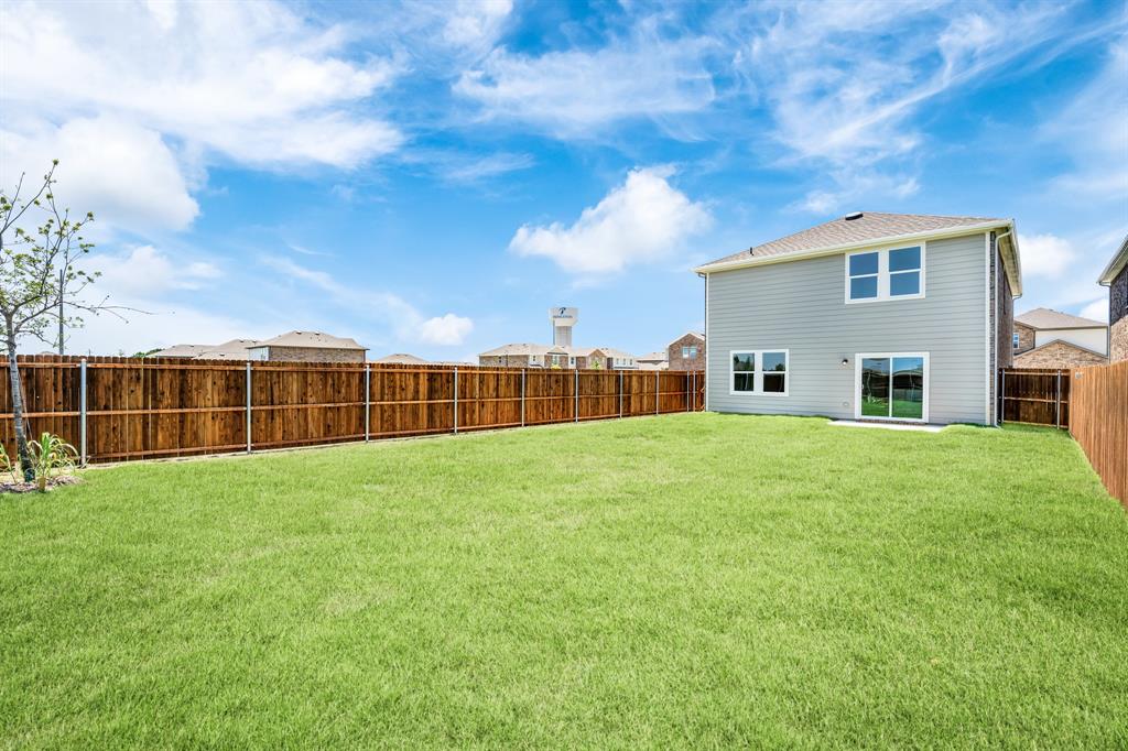 1707 Washington Street Princeton, TX 75407 - Photo 20 of 21 a view of a backyard