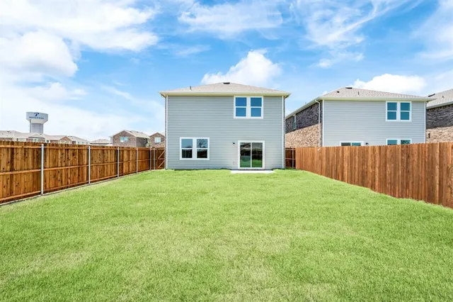 a view of a backyard of the house