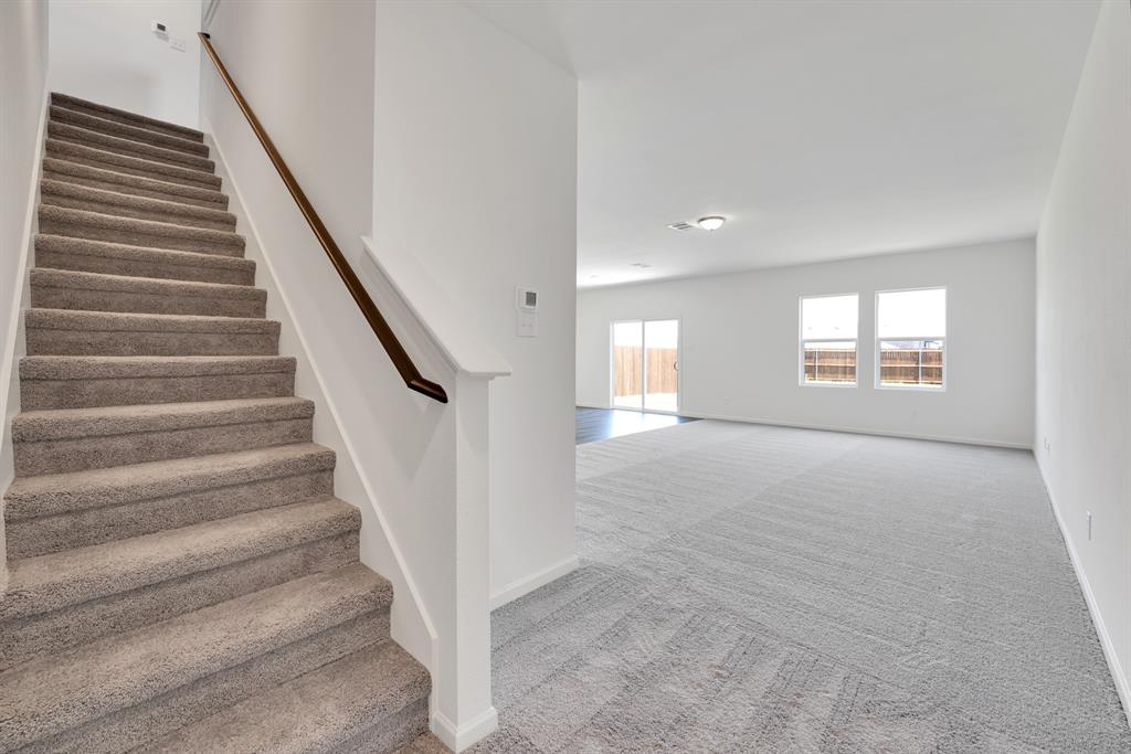1707 Washington Street Princeton, TX 75407 - Photo 9 of 21 a view of an empty room with windows