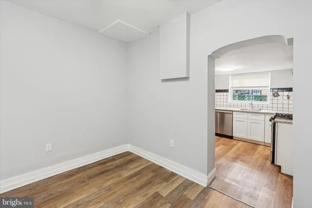 a view of a kitchen with wooden floor