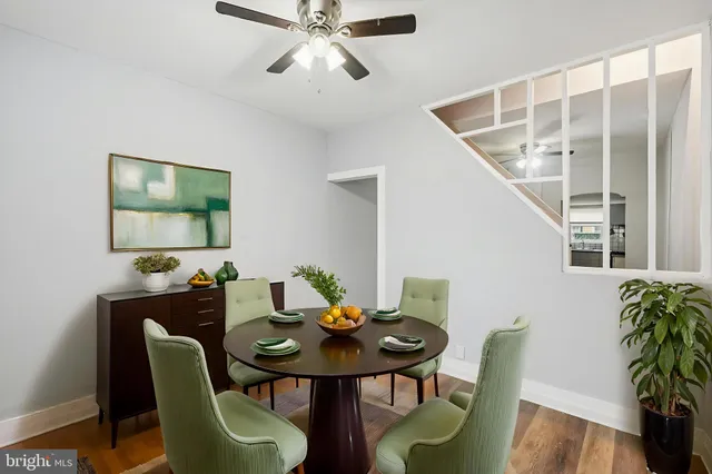 a view of a livingroom with furniture and a potted plant