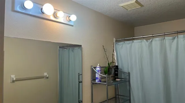 a bathroom with a sink and mirror