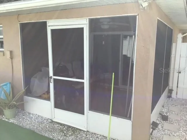 a bathroom with a glass shower door