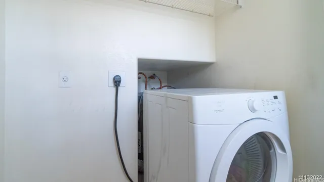 a bathroom with a sink a toilet and a window