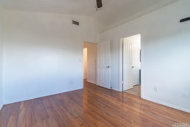 a bathroom with a toilet a sink and a mirror
