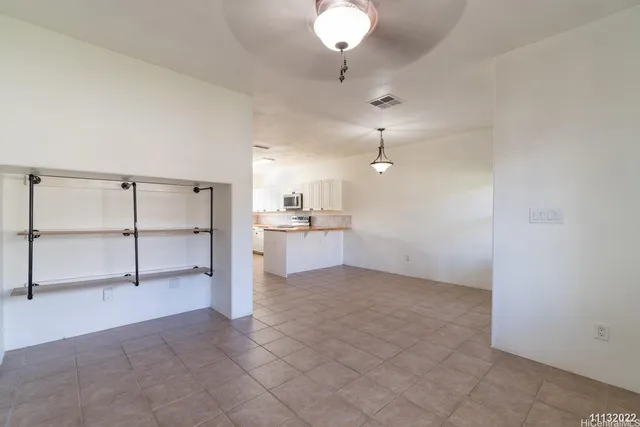 a view of a kitchen with a sink and cabinet