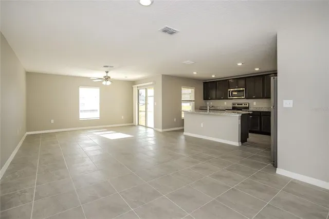 a view of a kitchen with a sink and a stove top oven