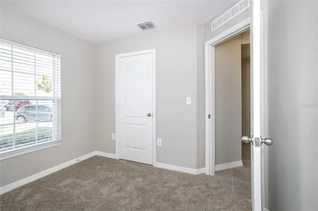 an empty room that has a window