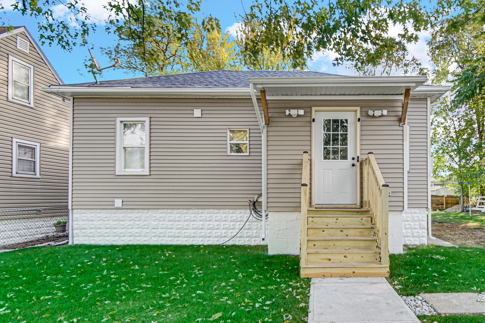 1047 Ralston Street Gary, IN 46406 - Photo 1 of 16 a view of a house with a small garden