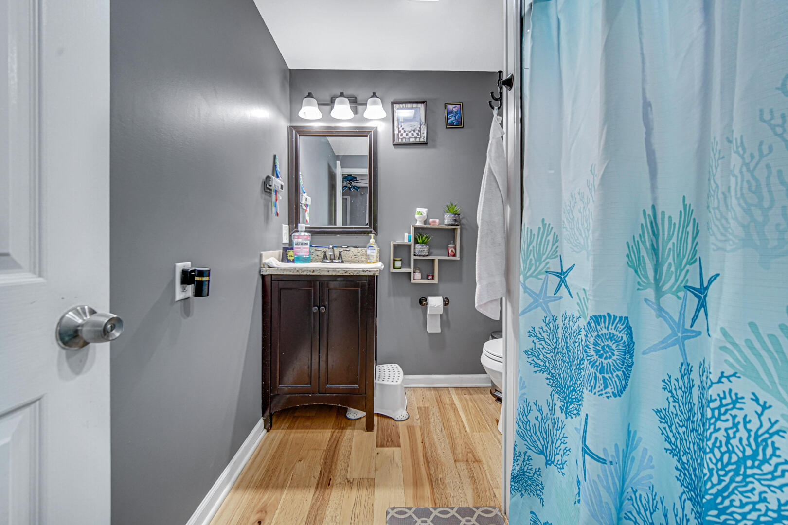 1047 Ralston Street Gary, IN 46406 - Photo 14 of 16 a bathroom with a sink and mirror with shower