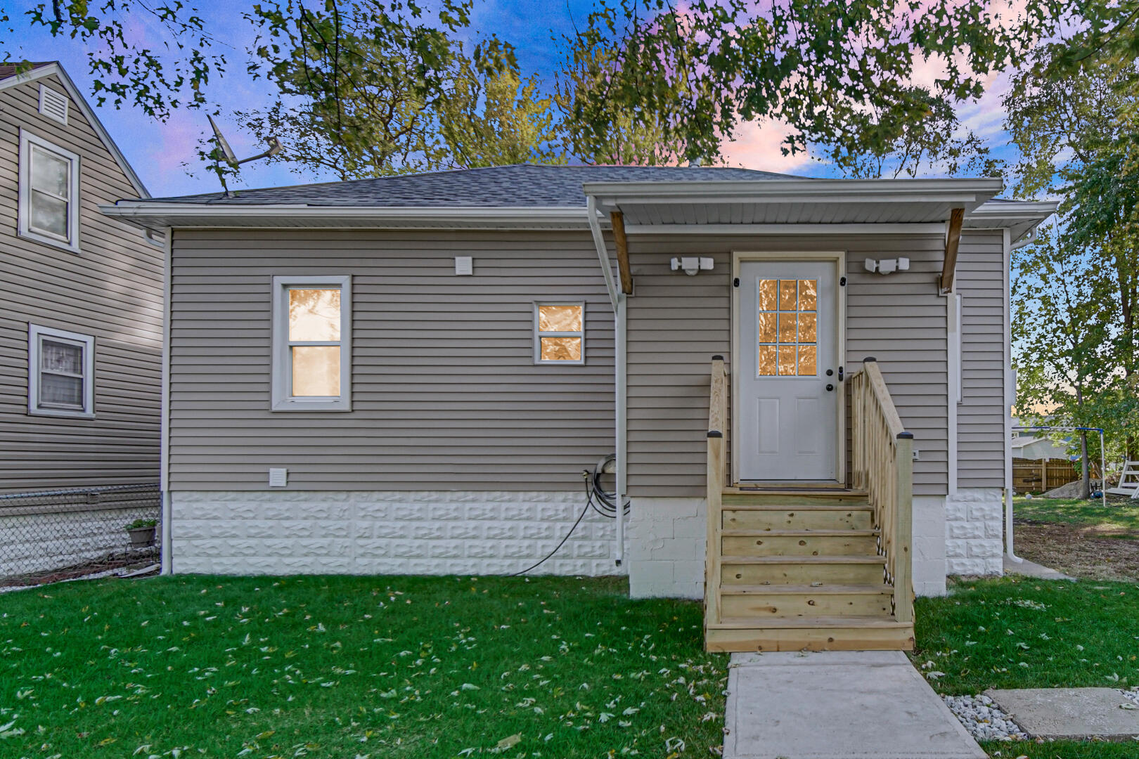 1047 Ralston Street Gary, IN 46406 - Photo 2 of 16 a front view of a house with garden