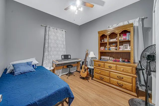 a bedroom with furniture and a bed