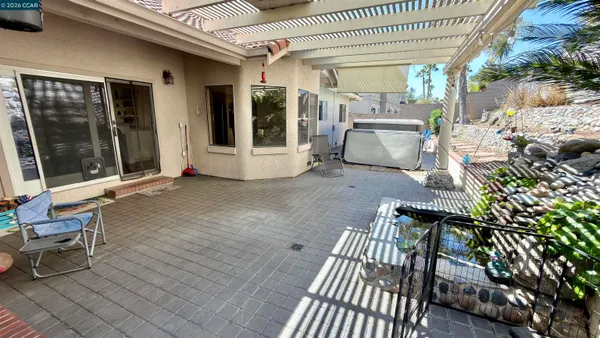 a view of a backyard with a patio
