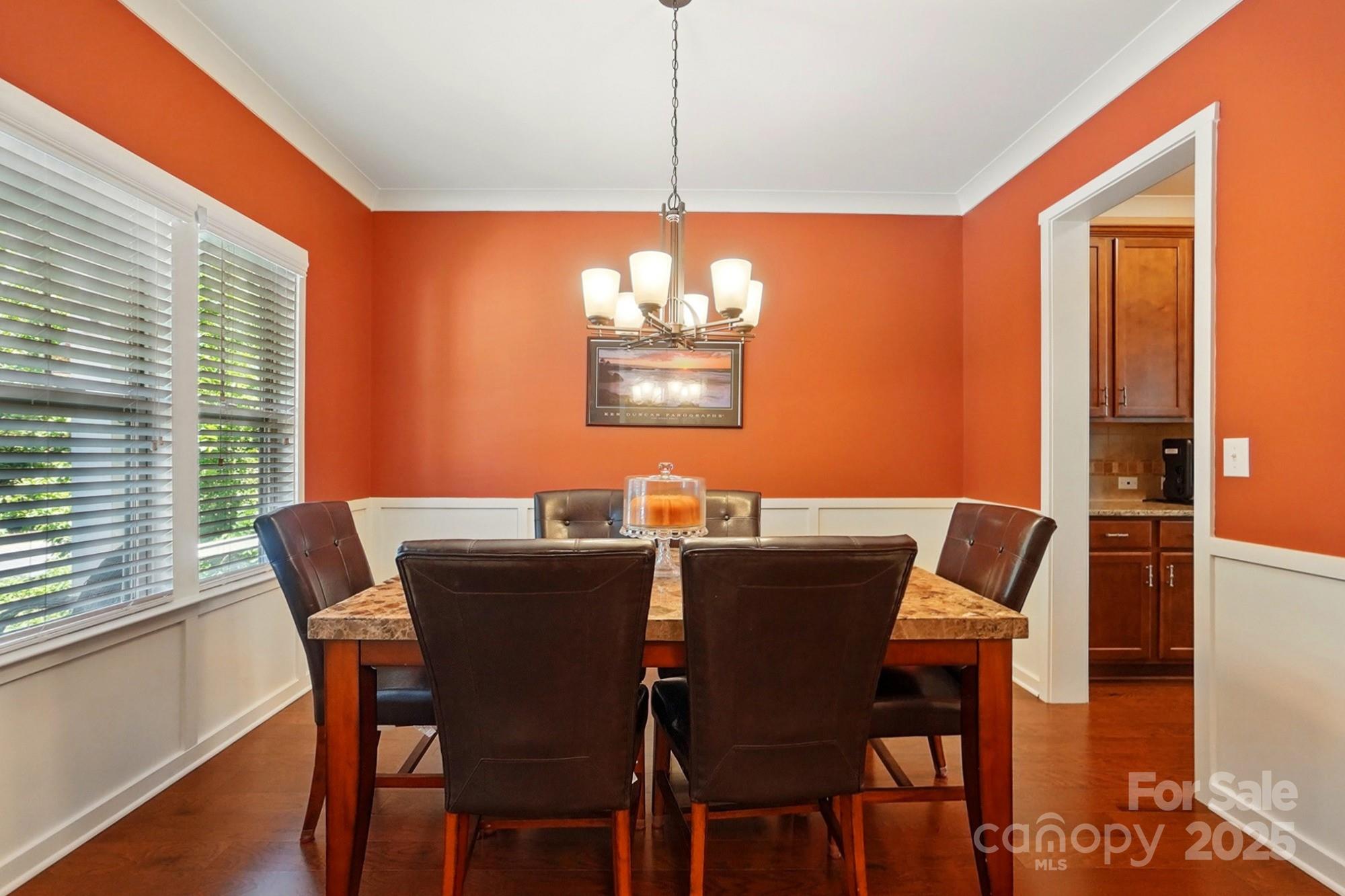 3106 Crosswind Drive Fort Mill, SC 29707 - Photo 11 of 43 a view of a dining room with furniture window and wooden floor