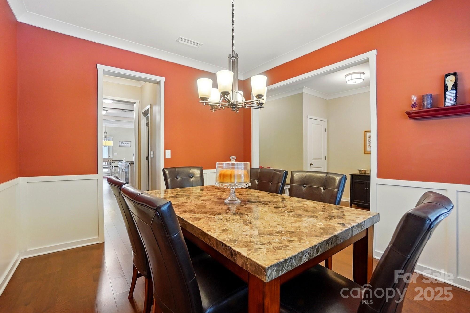 3106 Crosswind Drive Fort Mill, SC 29707 - Photo 13 of 43 a view of a dining room with furniture and chandelier