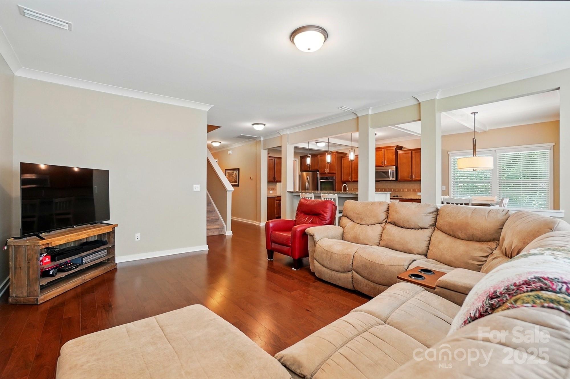 3106 Crosswind Drive Fort Mill, SC 29707 - Photo 16 of 43 a living room with furniture and a flat screen tv