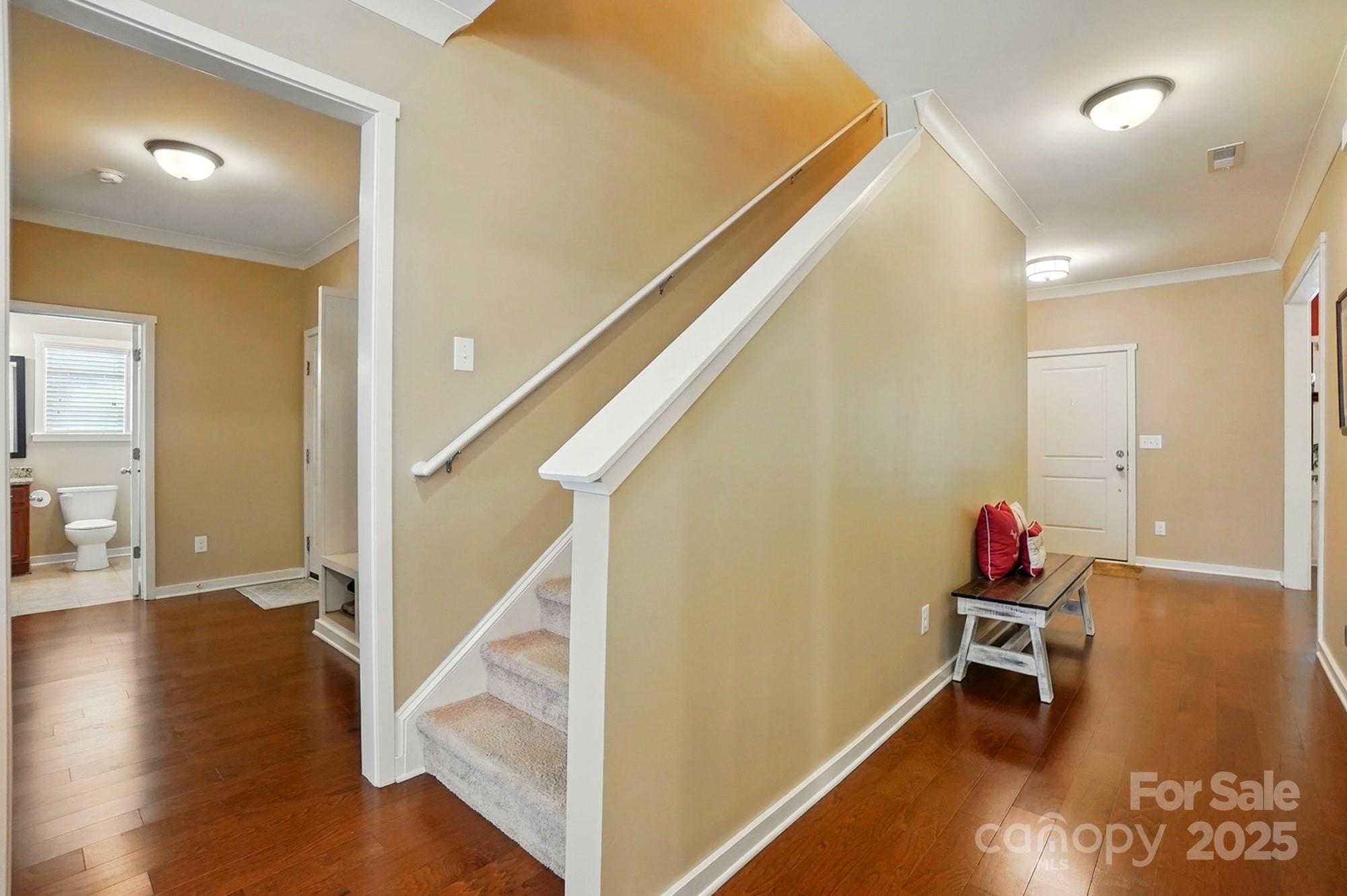 3106 Crosswind Drive Fort Mill, SC 29707 - Photo 25 of 43 a room with stairs and wooden floor