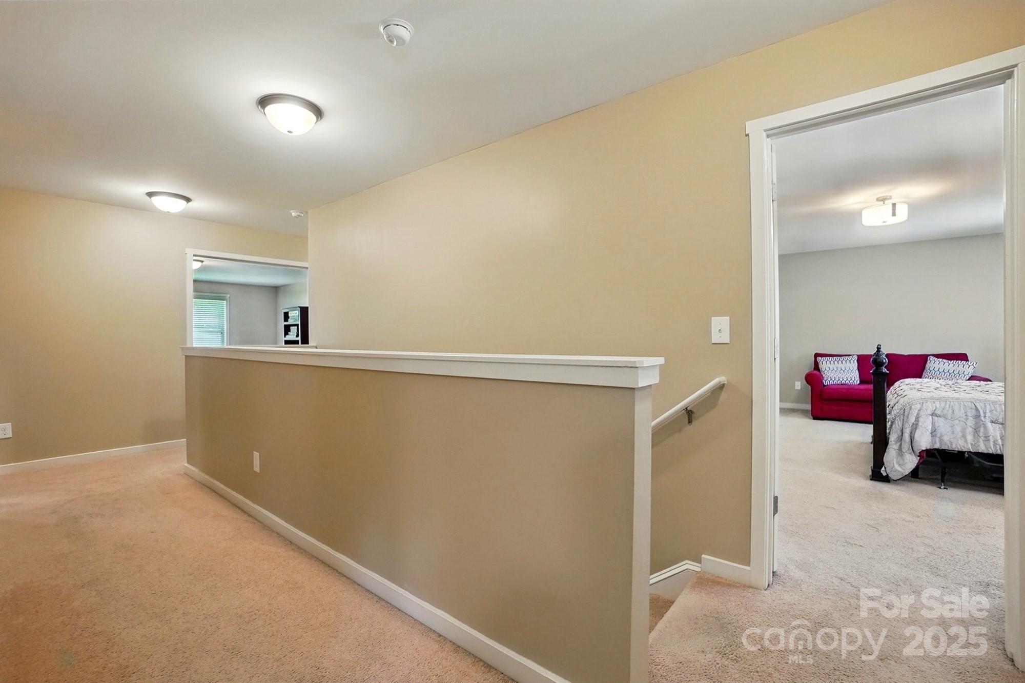 3106 Crosswind Drive Fort Mill, SC 29707 - Photo 26 of 43 a view of a room that has a bed and a in it