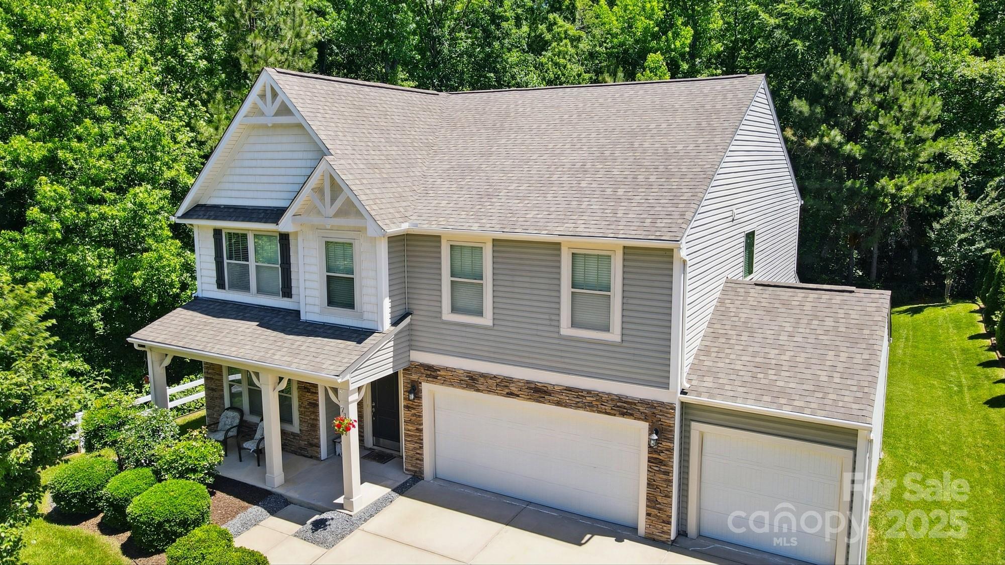 3106 Crosswind Drive Fort Mill, SC 29707 - Photo 3 of 43 a aerial view of a house with a yard and potted plants