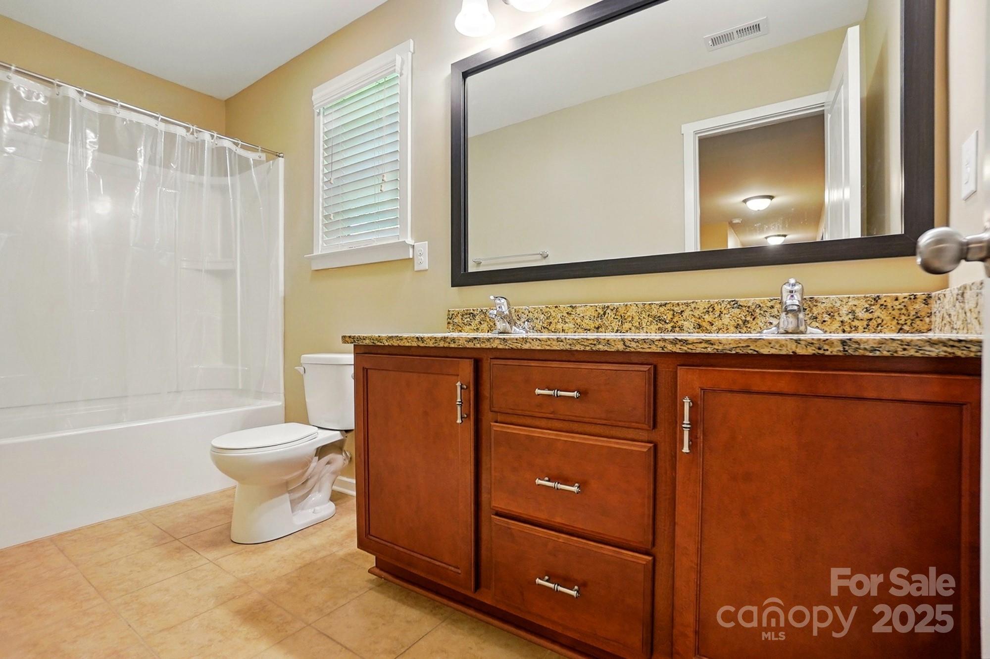 3106 Crosswind Drive Fort Mill, SC 29707 - Photo 33 of 43 a bathroom with a toilet a sink and a bathtub