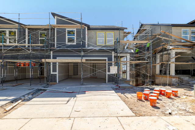 5240 South Acacia Drive, Unit 806 Mapleton, UT 84664 - Photo 1 of 5 Contemporary facade featuring dark siding and light stucco accents, multiple windows, an attached garage, and concrete driveway