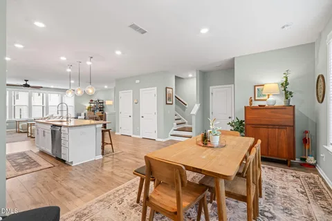 a kitchen with a table and chairs in it